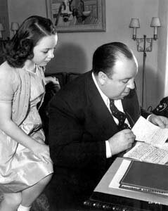 Alfred Hitchcock with his daughter, Patricia, a child actress.